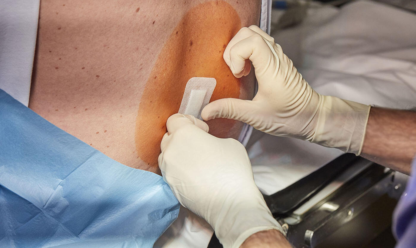 Doctor examining a patient’s back